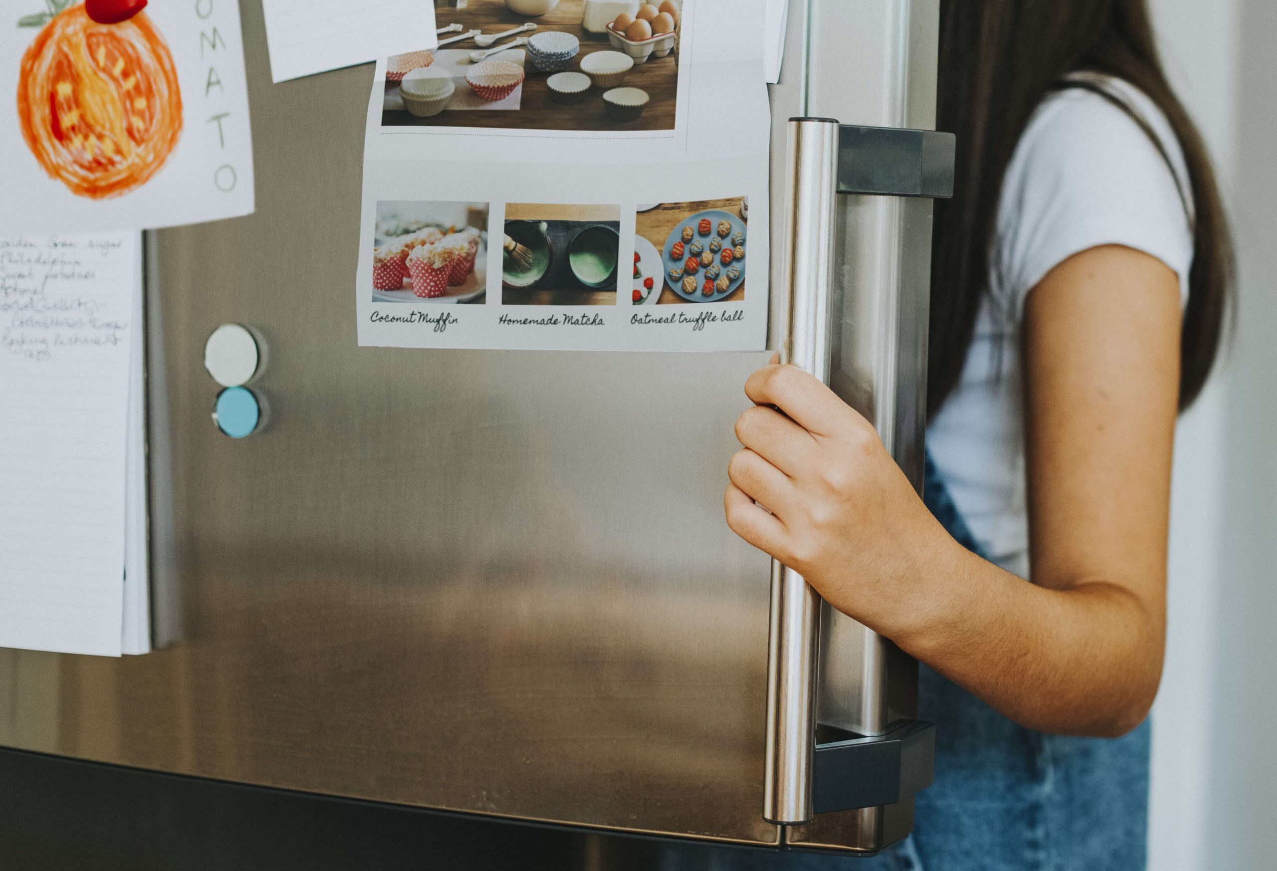 girl picking something eat out fridge 1 scaled